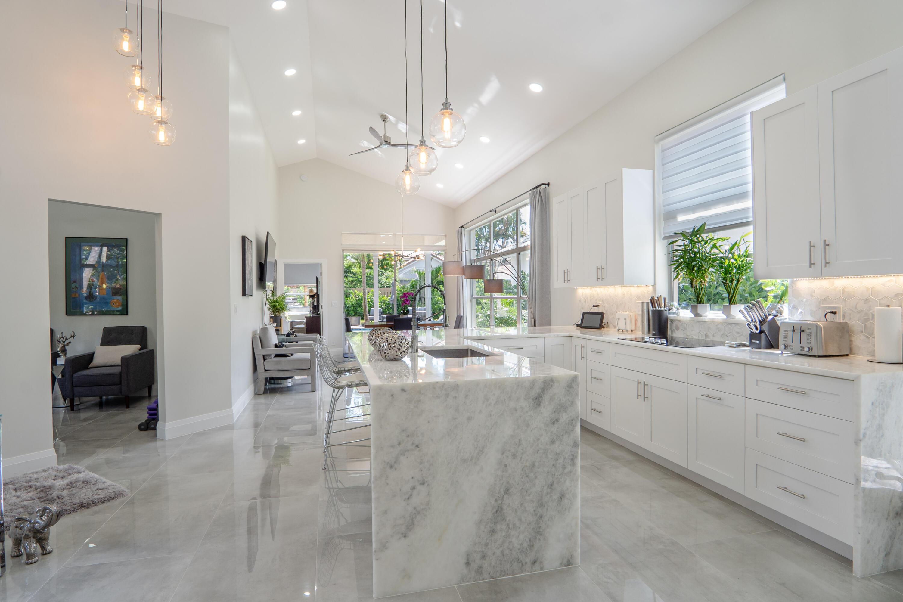 6670 Northwest 27th Avenue Boca Raton, FL 33496 - Photo 32 of 43 a large white kitchen with a large window