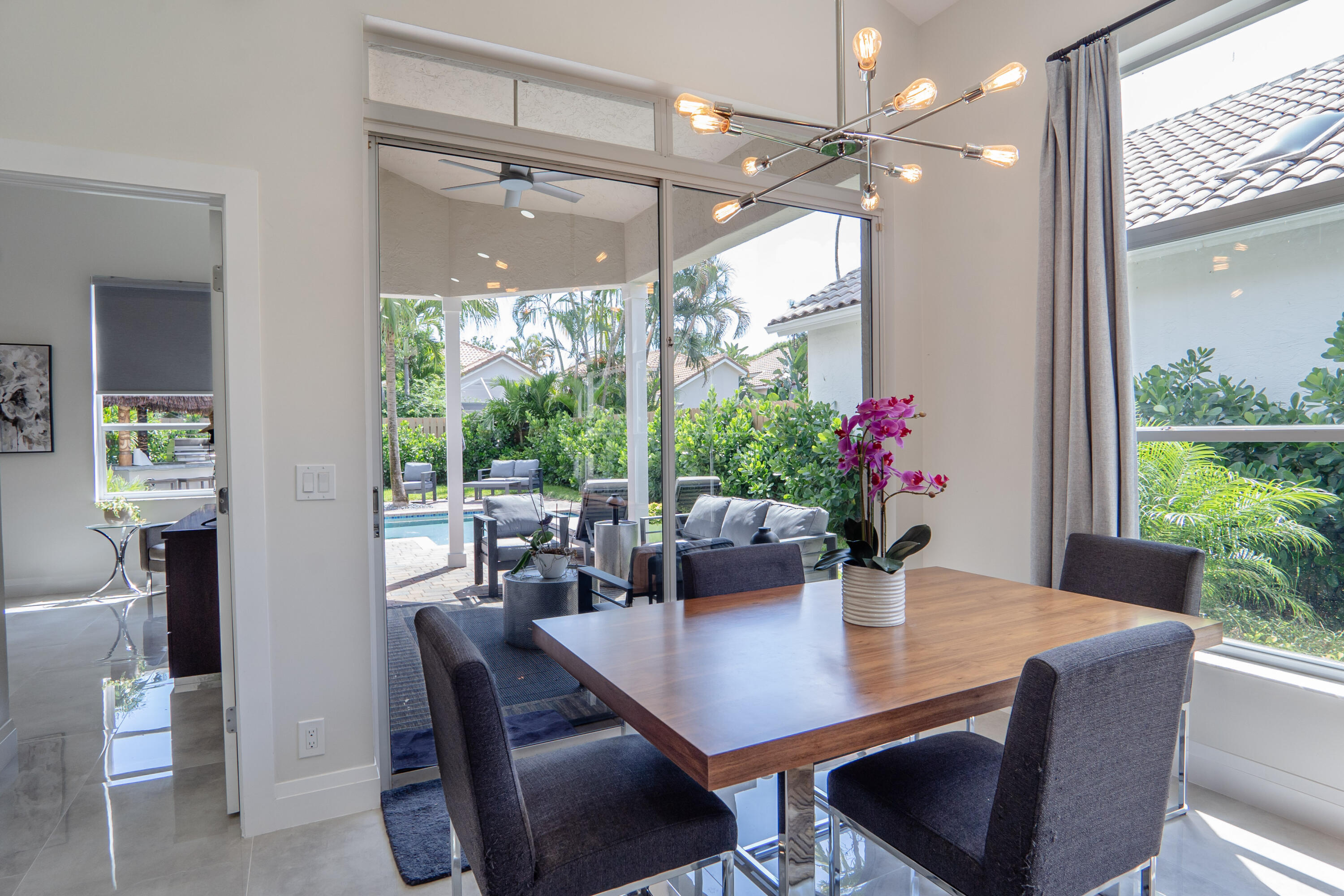 6670 Northwest 27th Avenue Boca Raton, FL 33496 - Photo 41 of 43 a view of a dining room with furniture window and outside view