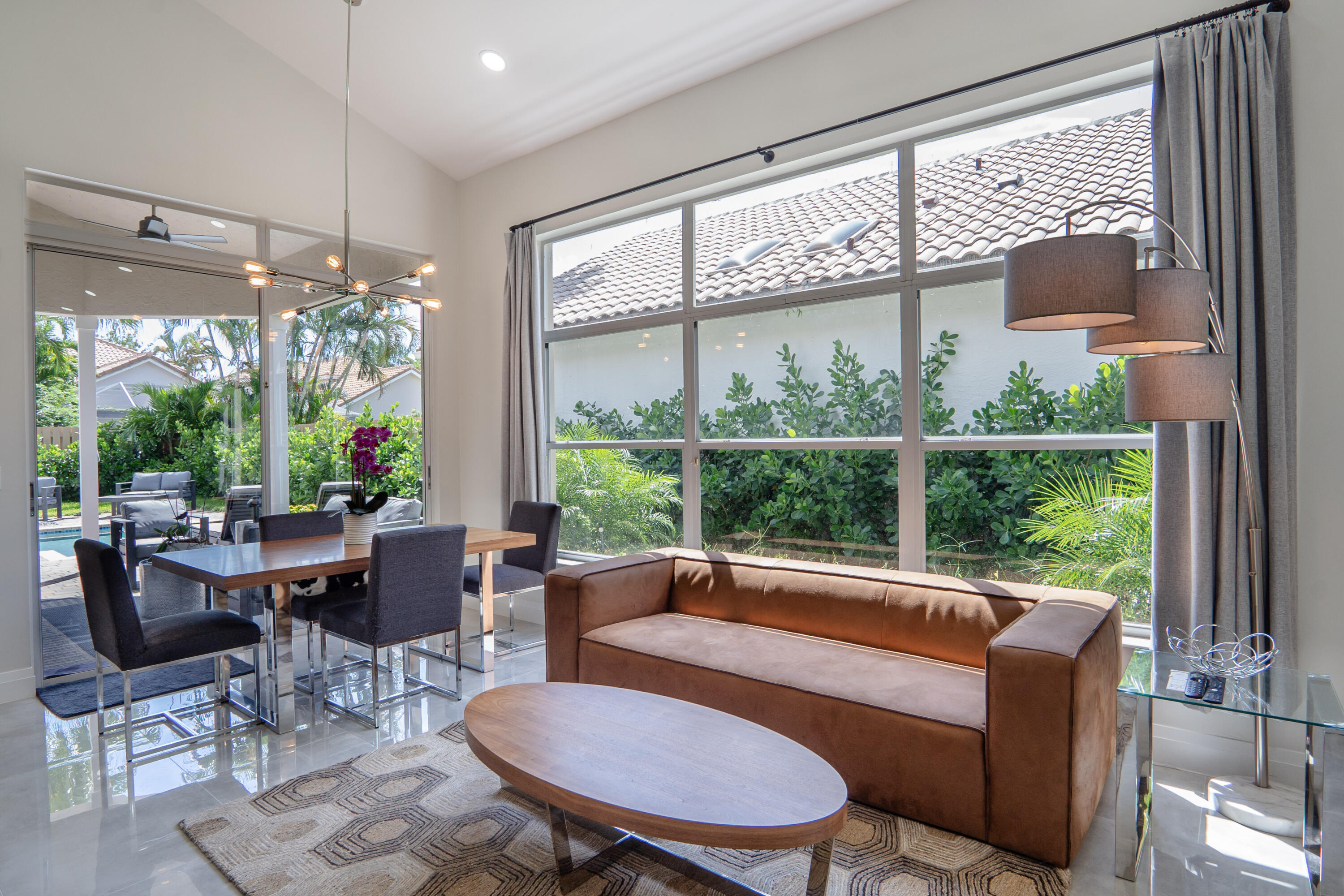 6670 Northwest 27th Avenue Boca Raton, FL 33496 - Photo 42 of 43 a living room with furniture and a large window
