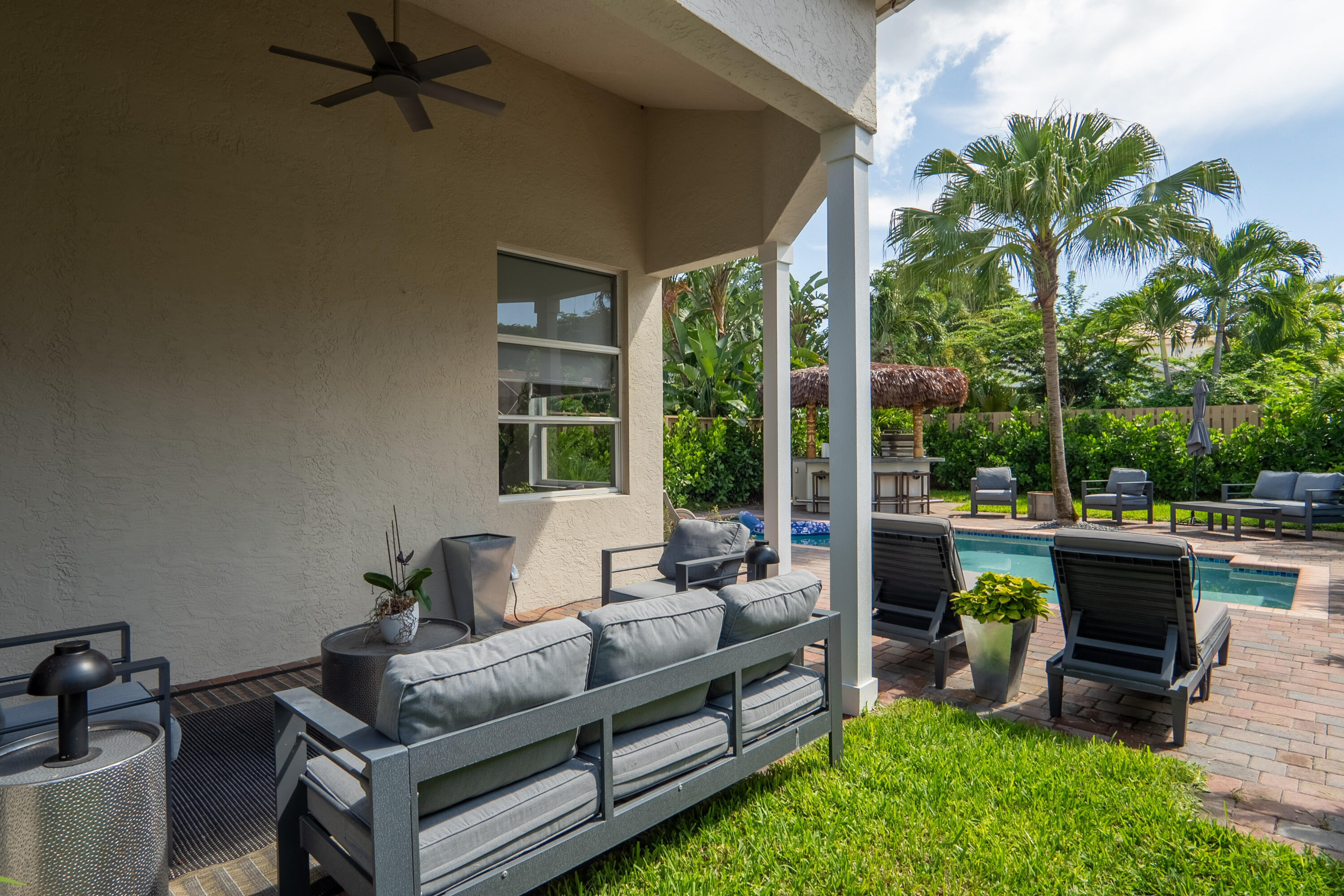 6670 Northwest 27th Avenue Boca Raton, FL 33496 - Photo 7 of 43 a living room with furniture and a potted plant