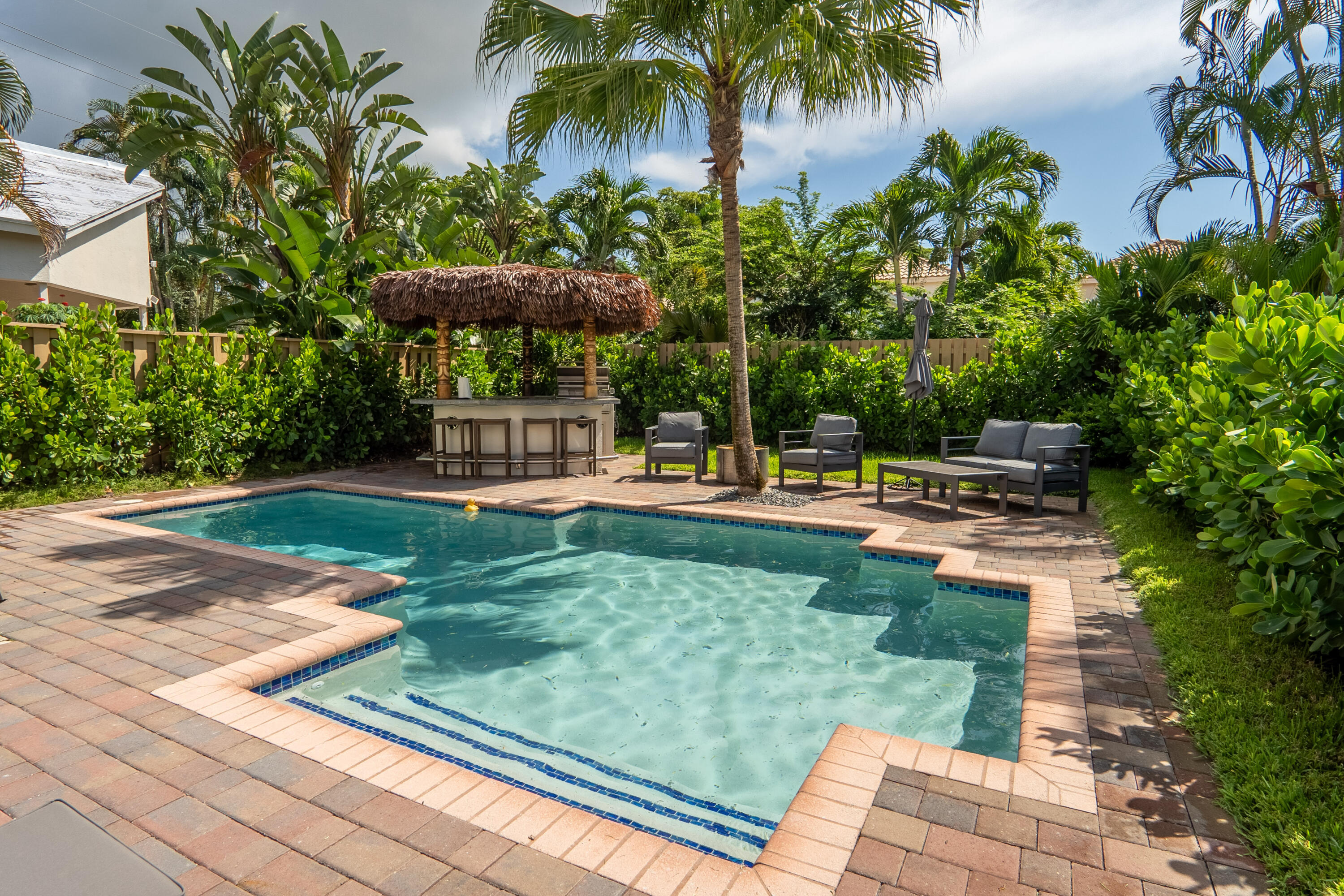 6670 Northwest 27th Avenue Boca Raton, FL 33496 - Photo 9 of 43 a garden view with a garden