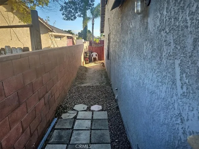 a view of a pathway both side of house