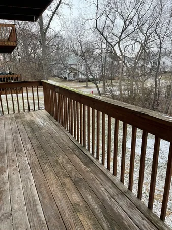 a view of balcony with wooden floor