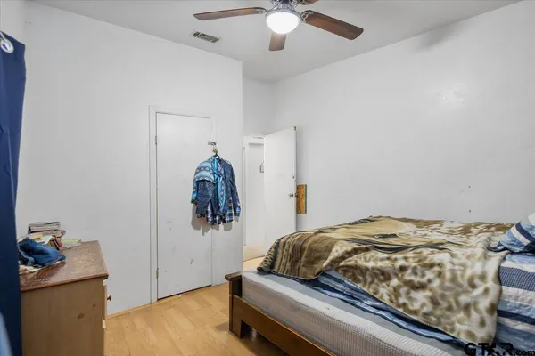 a kitchen with granite countertop a refrigerator stove top oven and sink