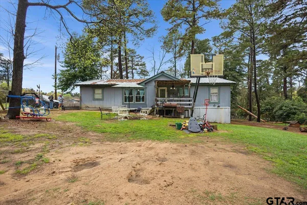a front view of a house with a yard and outdoor space