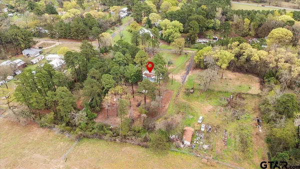 an empty room with furniture and a window