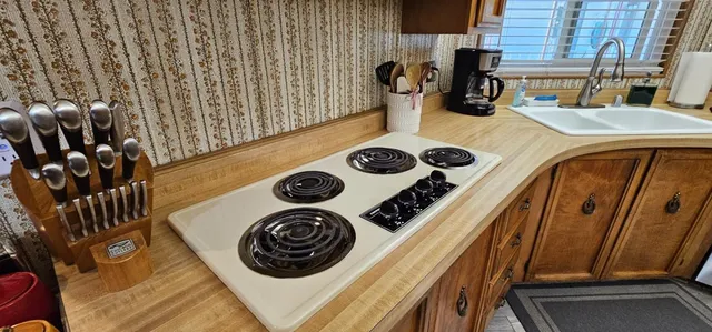 a close up of a stove top oven sitting inside of a kitchen