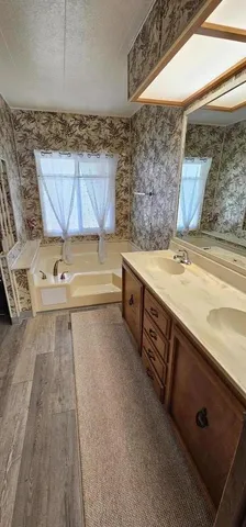 a bathroom with a bathtub and shower