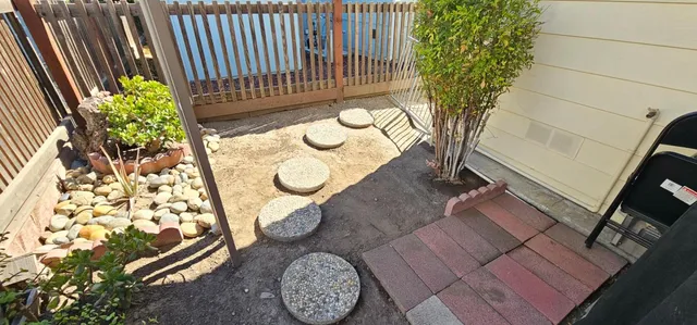 a view of an chairs and table in the balcony