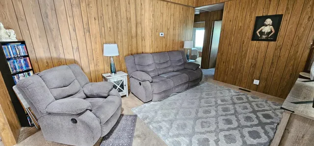 a living room with furniture and a rug