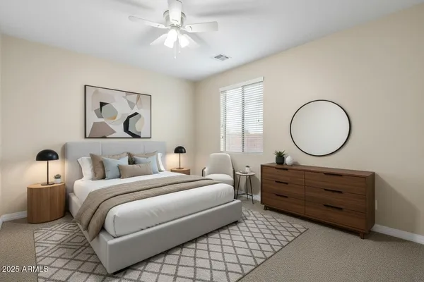 a bedroom with bed and window