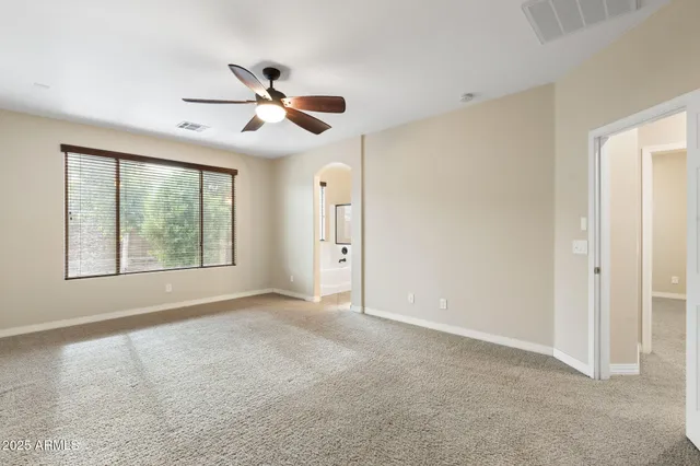 a backyard of a house with wooden fence