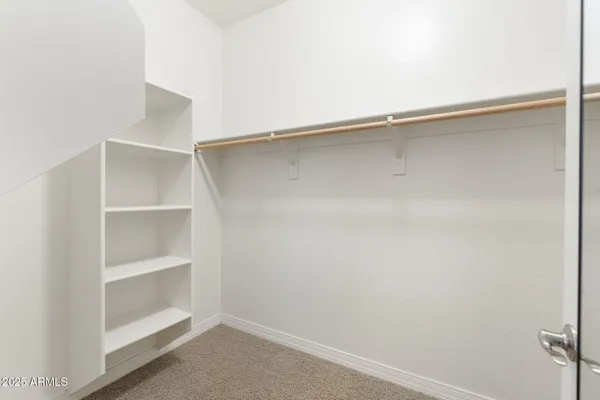 a view of a house with a yard and garden