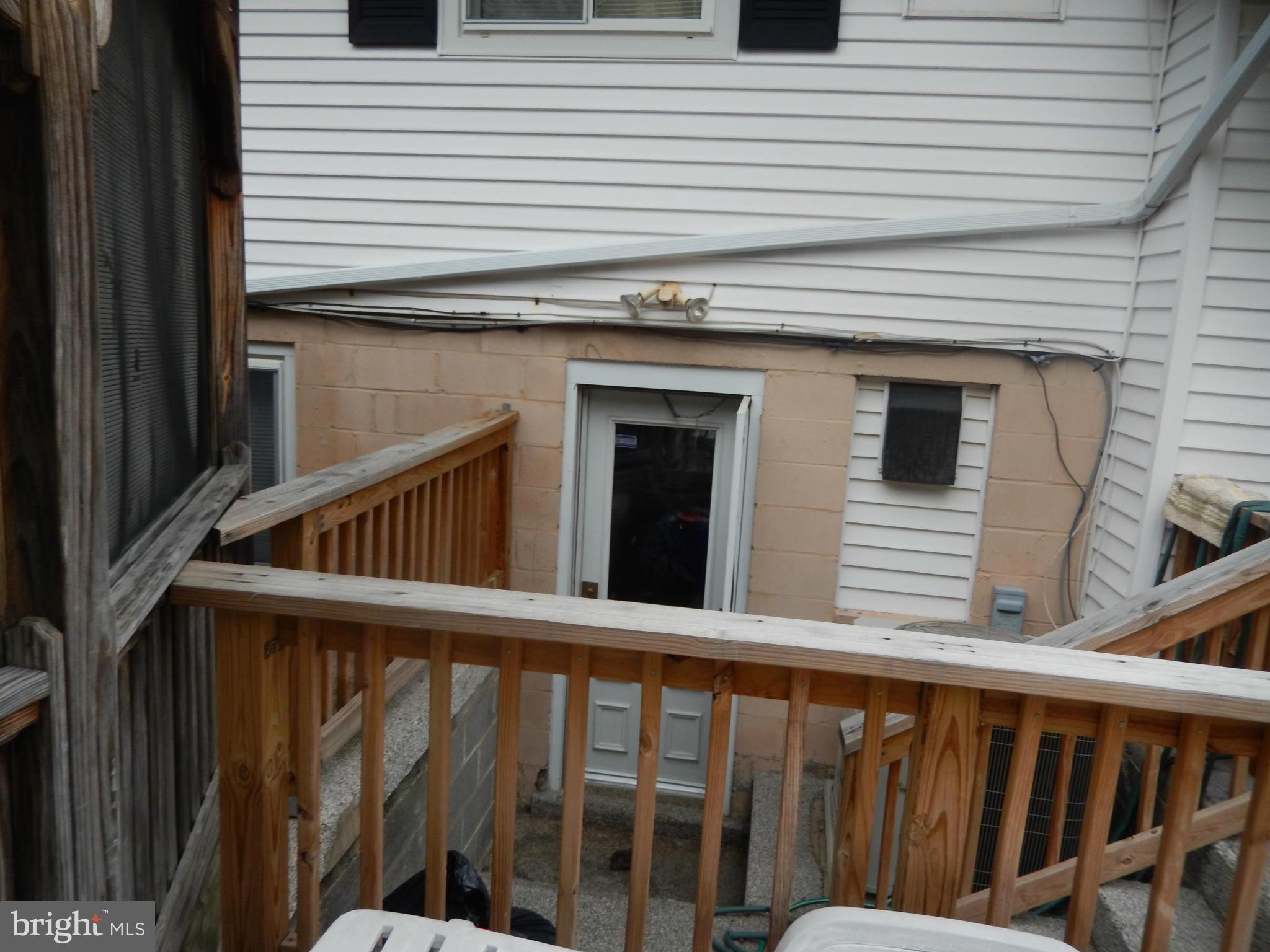 4706 Renn Street Rockville, MD 20853 - Photo 12 of 28 a view of a house with a deck