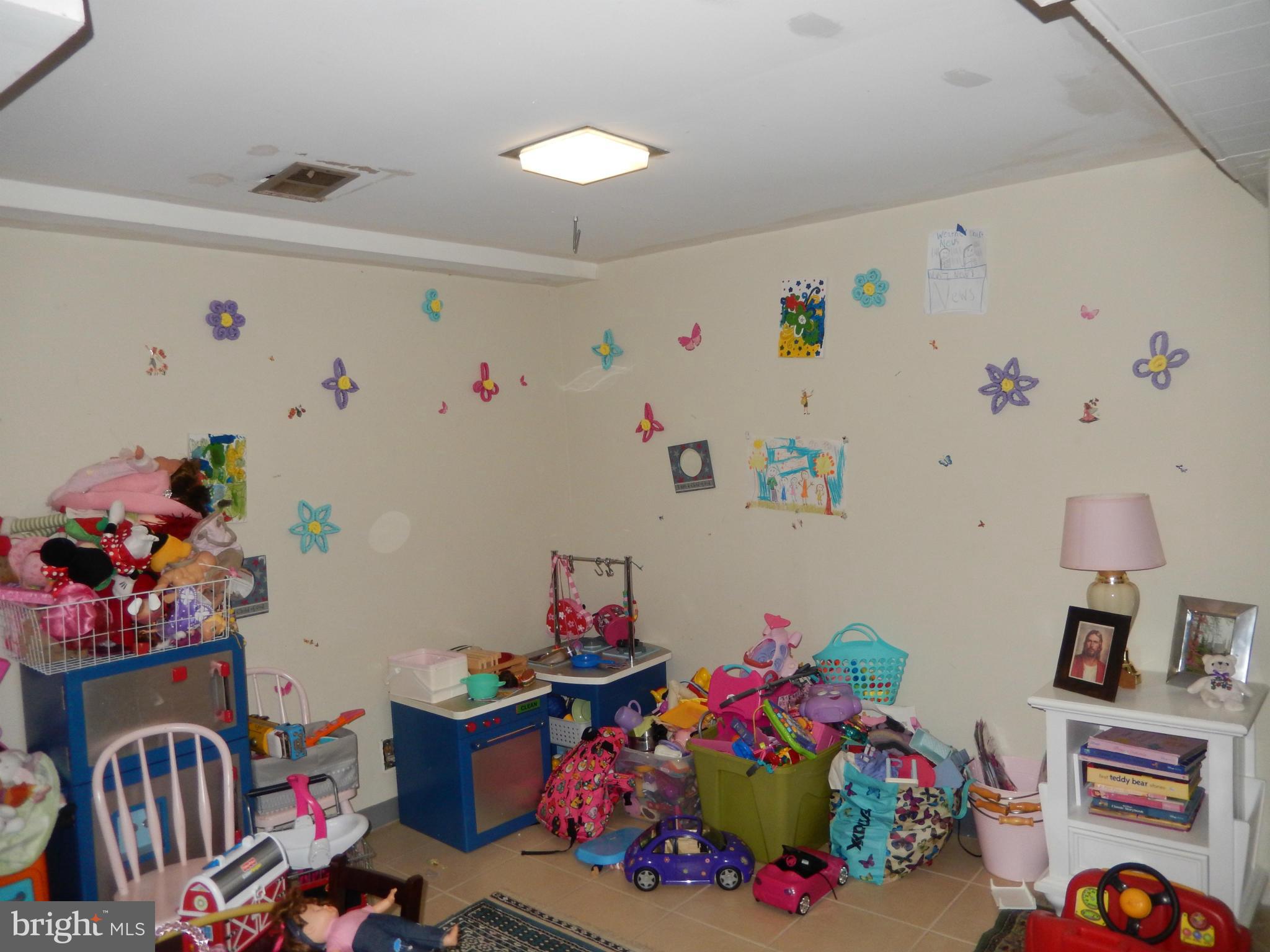 4706 Renn Street Rockville, MD 20853 - Photo 16 of 28 a play room with toys