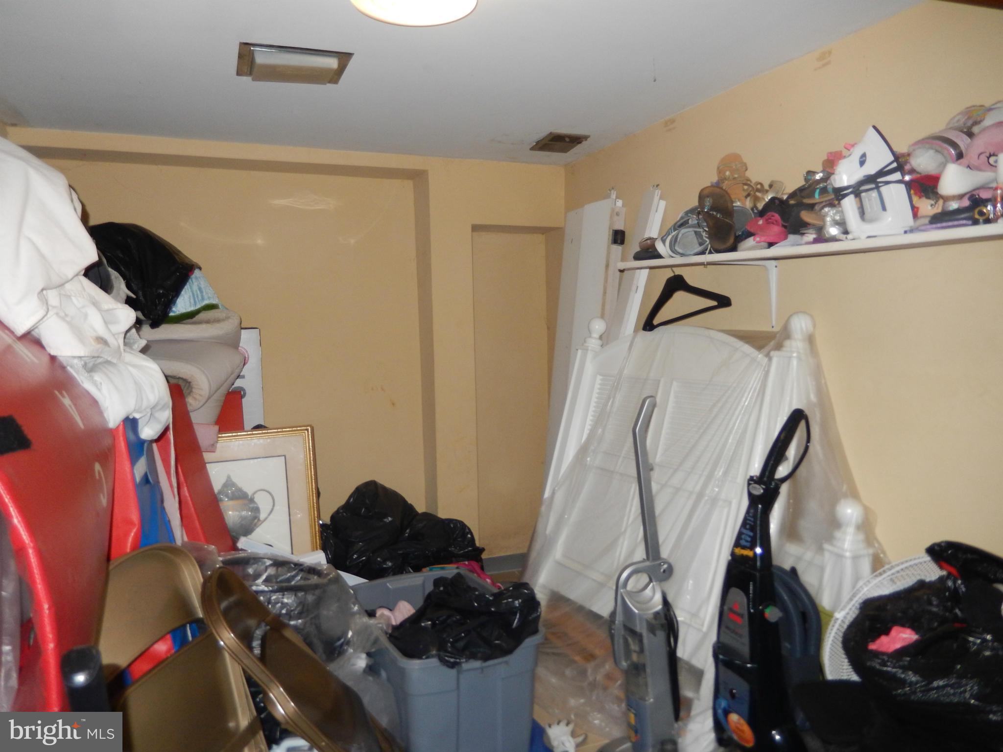 4706 Renn Street Rockville, MD 20853 - Photo 17 of 28 a view of a closet with storage