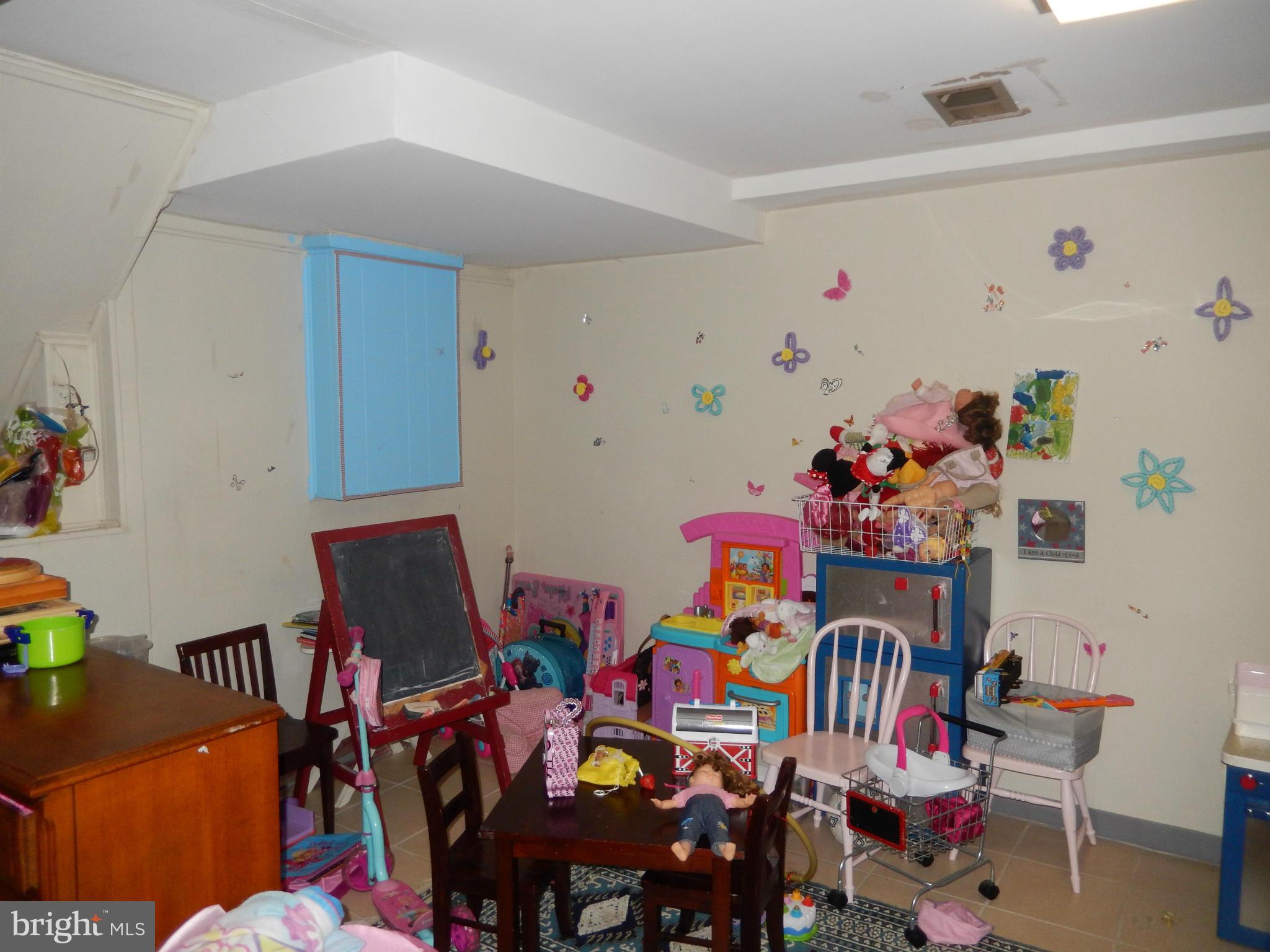 4706 Renn Street Rockville, MD 20853 - Photo 19 of 28 a group of people sitting in a kitchen with furniture