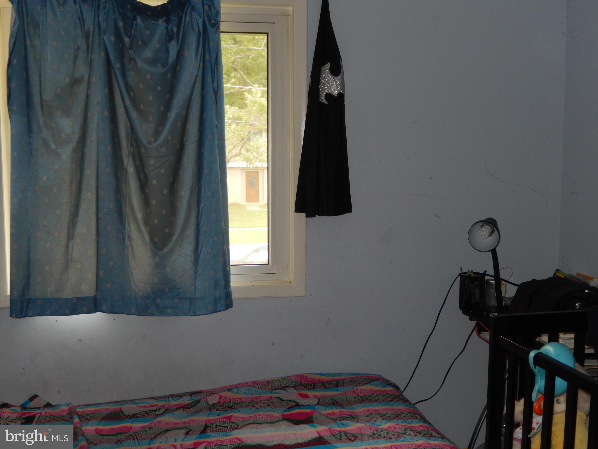 4706 Renn Street Rockville, MD 20853 - Photo 24 of 28 a room with a window and a closet