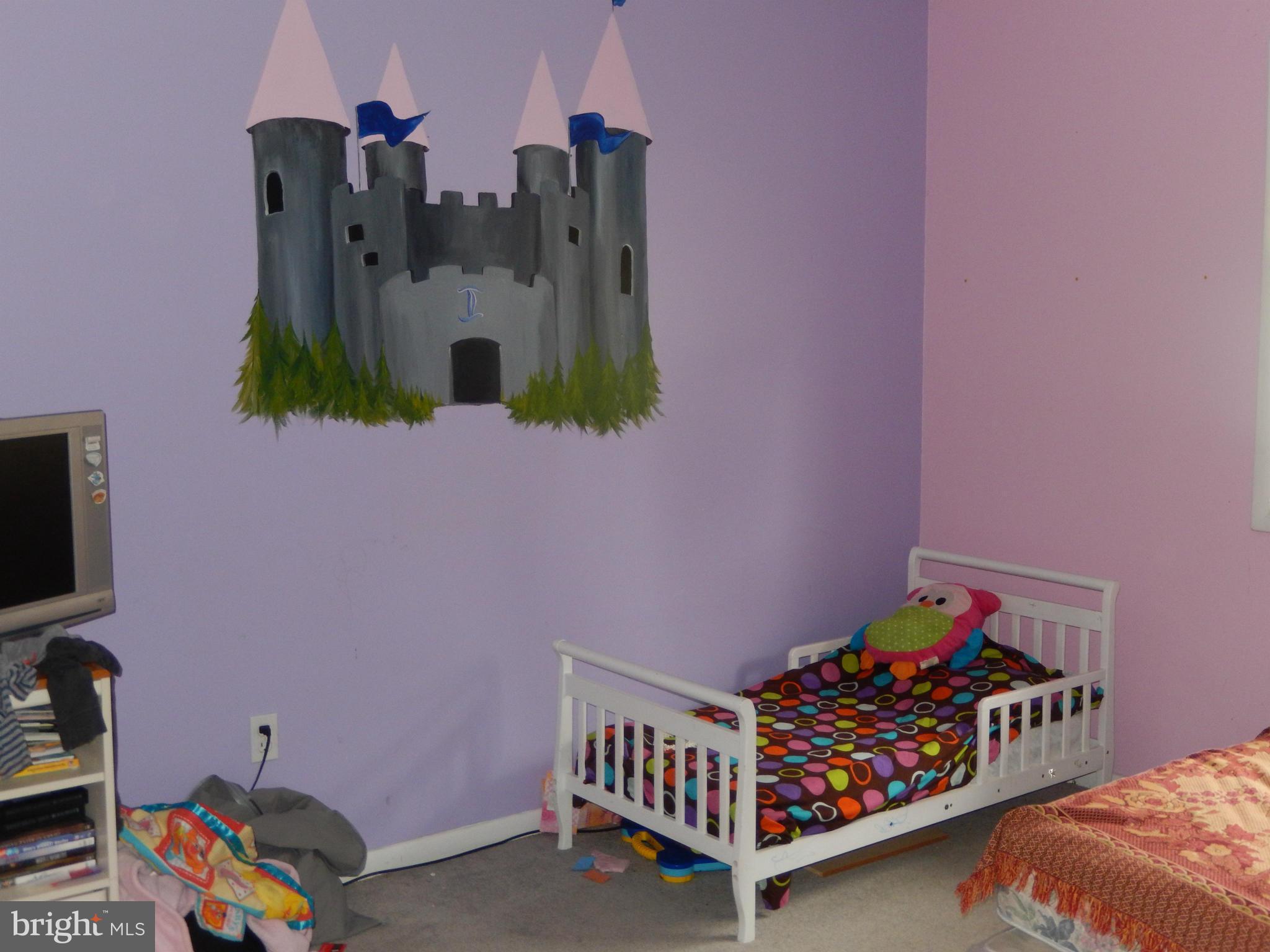 4706 Renn Street Rockville, MD 20853 - Photo 25 of 28 a bedroom with furniture and baby crib