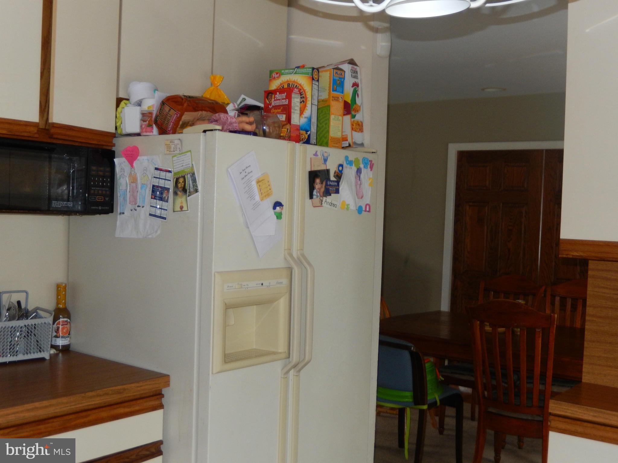 4706 Renn Street Rockville, MD 20853 - Photo 26 of 28 a room with refrigerator and washer