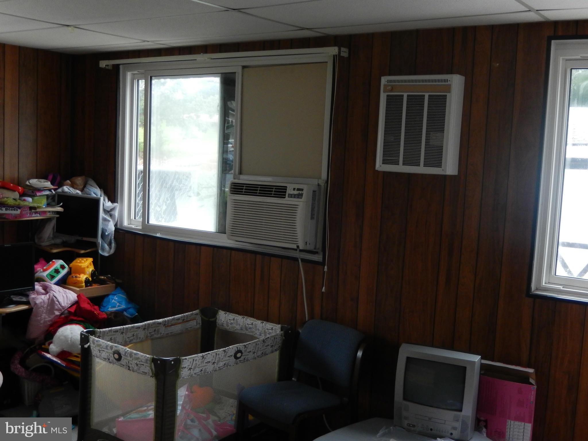 4706 Renn Street Rockville, MD 20853 - Photo 28 of 28 a living room with furniture and a window