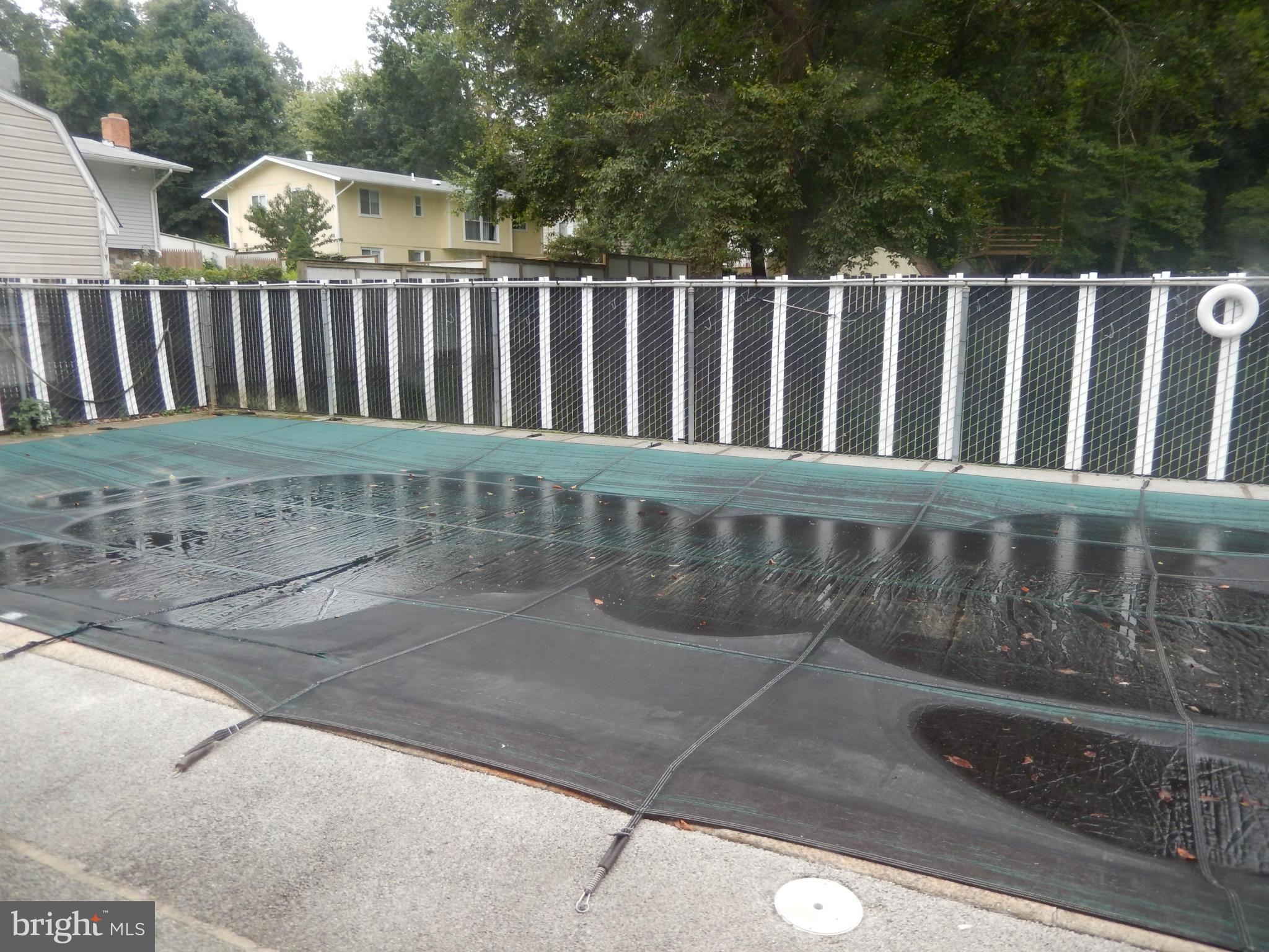 4706 Renn Street Rockville, MD 20853 - Photo 5 of 28 a view of a wooden fence