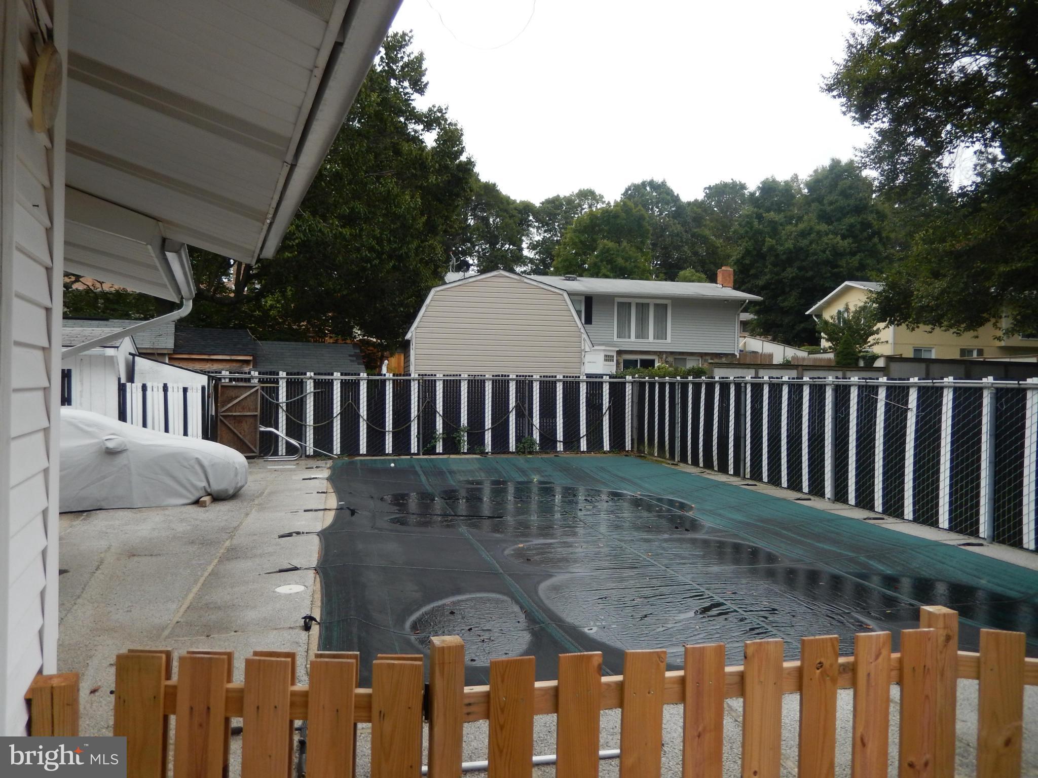 4706 Renn Street Rockville, MD 20853 - Photo 9 of 28 a view of a backyard with a deck
