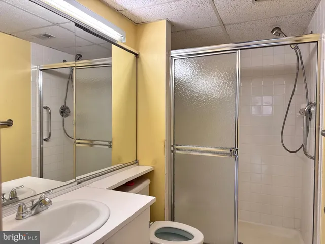 a bathroom with a sink and shower