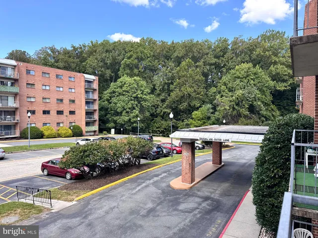 a view of a chairs and table in the backyard