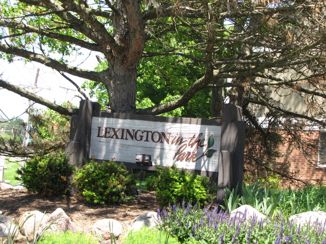 274 Appletree Court, Unit 274 Buffalo Grove, IL 60089 - Photo 15 of 15 a sign that is next to a tree