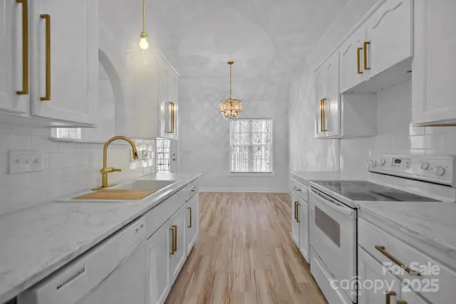 a kitchen that has a sink and cabinets