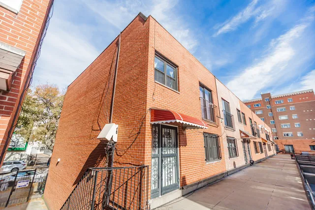 a front view of a building with glass windows