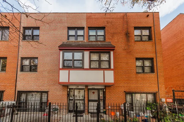 a bed room with a bed and a chandelier