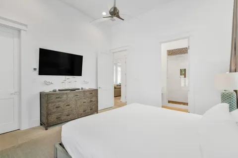 a kitchen with granite countertop a sink stove and cabinets