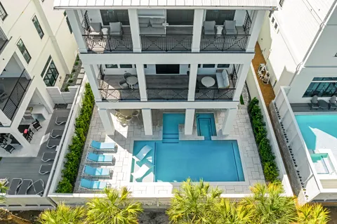a large bedroom with a bed and wooden floor