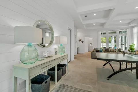a view of a livingroom with furniture and staircase