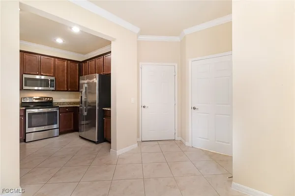 a kitchen with a refrigerator and a refrigerator