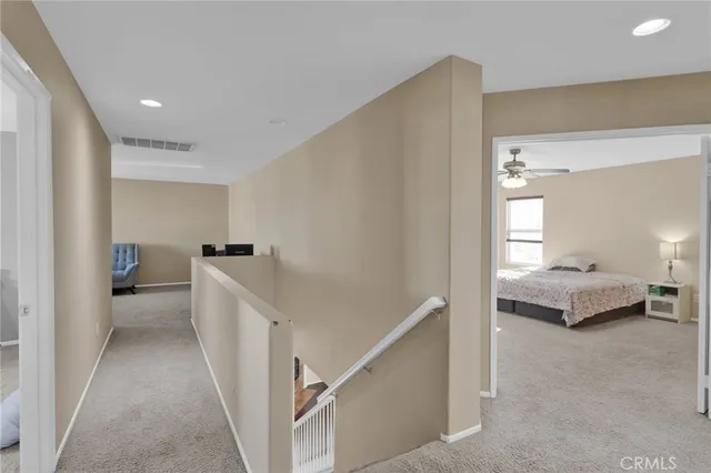 a bedroom with a bed and a lamp