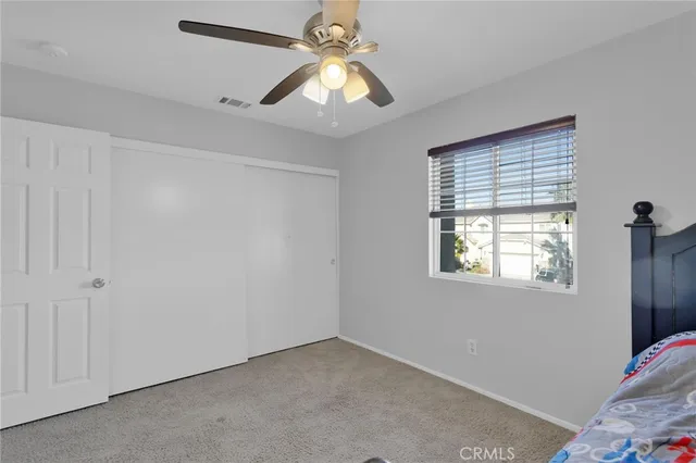 a view of livingroom with window and ceiling fan