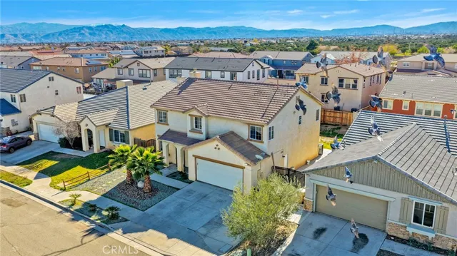 an aerial view of a house with a ocean view
