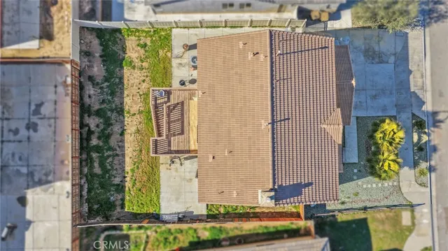an aerial view of a house with swimming pool
