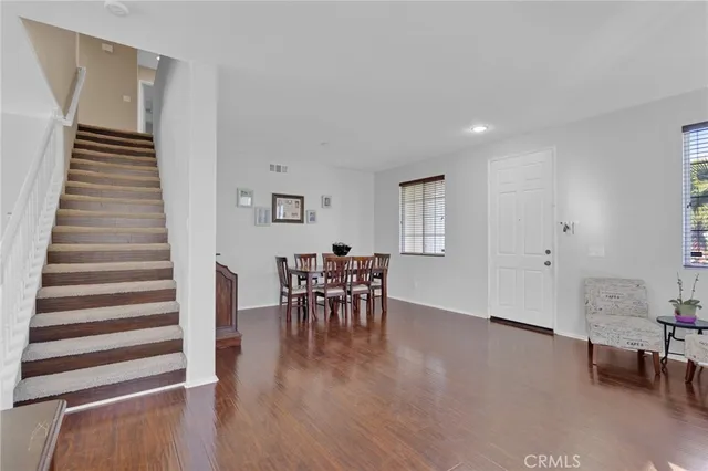 a view of a livingroom with furniture and wooden floor