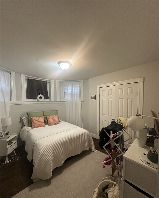 847 Beacon Street, Unit 9 Boston, MA 02215 - Photo 3 of 10 a bedroom with a bed and a table