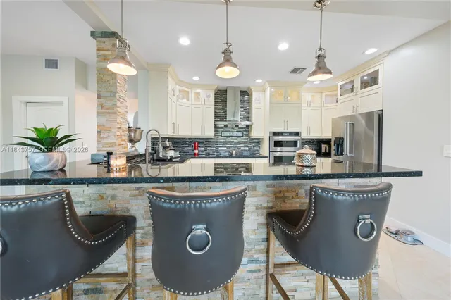 $1,699,999 | 9621 West Calusa Club Drive, Miami, FL 33186