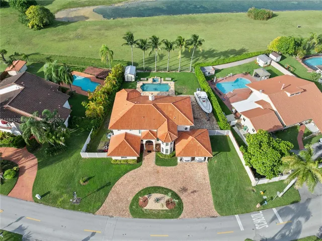 $1,699,999 | 9621 West Calusa Club Drive, Miami, FL 33186