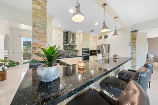 $1,699,999 | 9621 West Calusa Club Drive, Miami, FL 33186