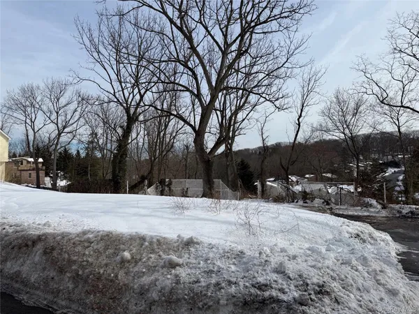 a wooden bench sitting in middle of snow