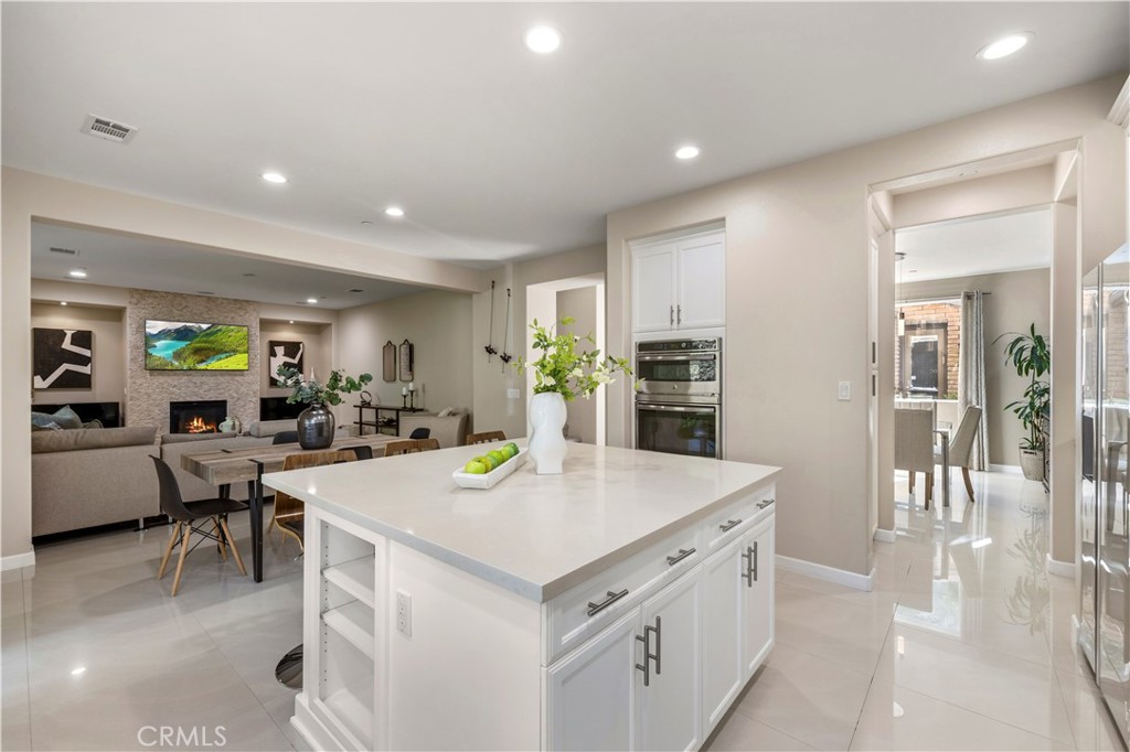 28613 Stonegate Court Valencia, CA 91354 - Photo 14 of 56 a view of kitchen with cabinets and wooden floor