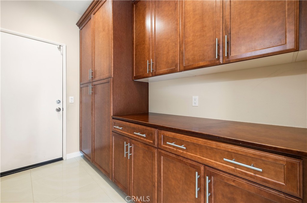 28613 Stonegate Court Valencia, CA 91354 - Photo 17 of 56 a view of a kitchen with wooden cabinets