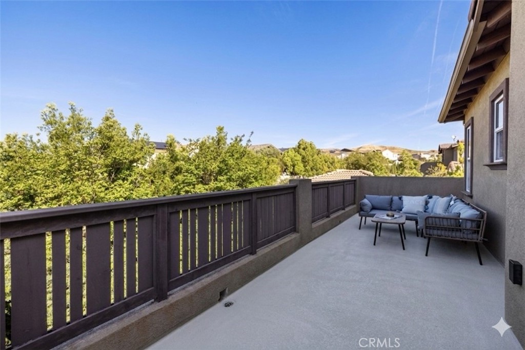 28613 Stonegate Court Valencia, CA 91354 - Photo 30 of 56 a balcony with chairs